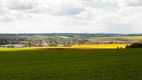 View of rural landscape with fields and suburban houses Stock Photos