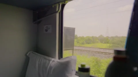 View of Rural Landscape from Inside Indian Railways Sleeper Coach Stock Footage 344070548