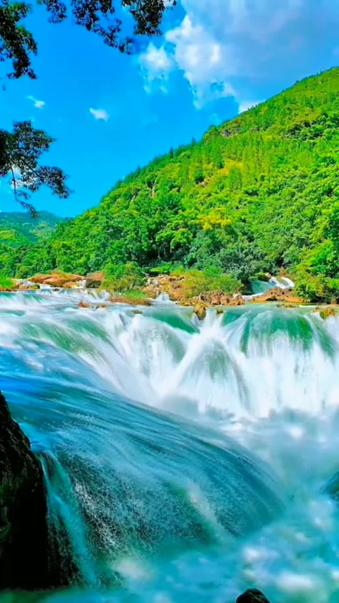 View of the rushing river on the green hillside Stock Footage 203933518