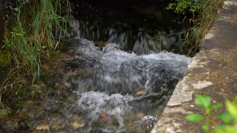 View of the rushing stream of water in a mountain stream Stock Footage 120748399