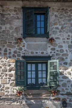 View of a rustic granite stone masonry facade of a traditional Portuguese Stock Photos