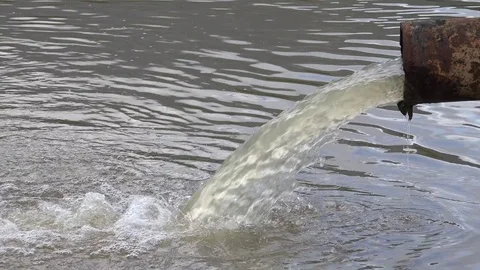 View of rusty drain in pure lake industrial garbage liquid toxic water substance Stock Footage 81966952