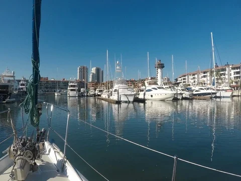 View from sailboat as it moves through and out of the marina Vídeos de archivo 79707396