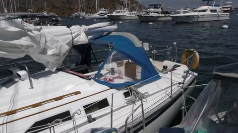 View of sailboat tied to side of another boat moving with the waves in Catali Video stock 67519771