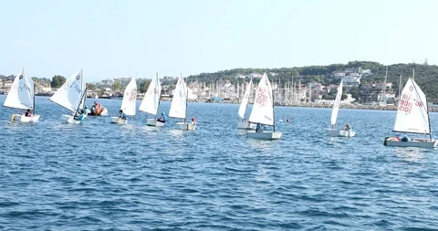 A view of sailboats Optimist learning to sail in Mediterranean 5 Video stock 113895258