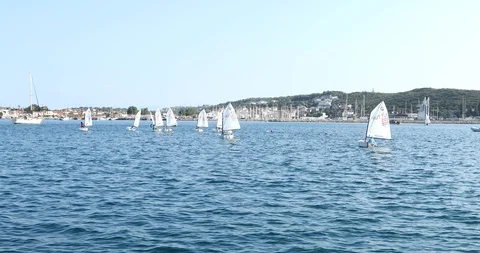 A view of sailboats Optimist learning to sail in Mediterranean 8 스톡 동영상 113896371