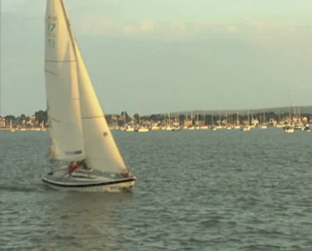 View of sailing boat from passing boat Stock Footage