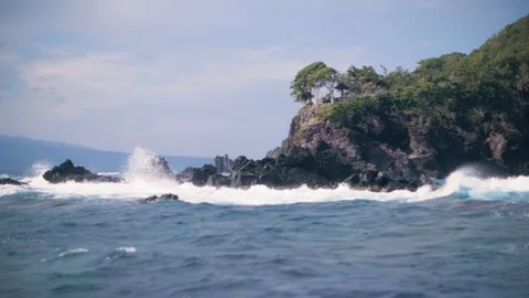 A view from a sailing ferry. Strong ocean waves splashing and crashing on rocks. Stock Footage 122185771