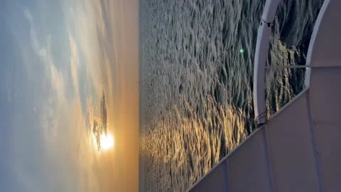View from a sailing ship at sea sunset - Vertical stock video Stock Footage 239640775