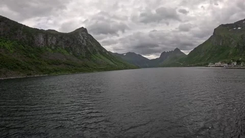 View sailing through open Gryllefjord waters surrounded by mountains in Norway Vidéo 342755785