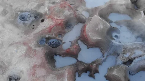 View of Salar de Uyuni with several pools of brine and air bubbles rising throug Stock-Footage 125484749