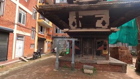 View of the salima temple and priest's house with a boy running past 스톡 동영상 210969641