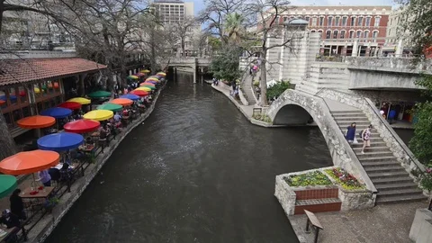 View of the San Antonio River Walk with restaurants and people, Texas, USA Stock Footage 83195050