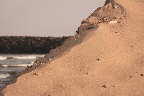 View of sand dune with beach in background, Kovalam, Chennai, India Stock Photos