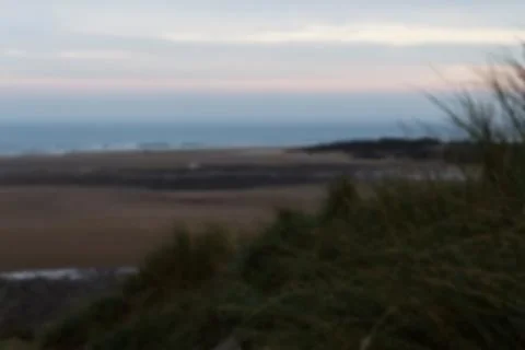 View from the sand dunes at first light Out of focus. Stock Photos