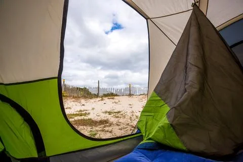 View of sand dunes from inside a camping tent at Assateague Island, Maryland Stock Photos