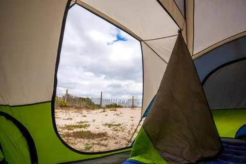View of sand dunes from inside a camping tent at Assateague Island, Maryland Stock Photos