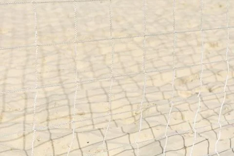 View of the sand through the protective grid. Stock Photos