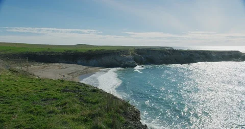 View of a sandy beach from the bluffs at Montana de Oro State Park, California Stock Footage 99145936