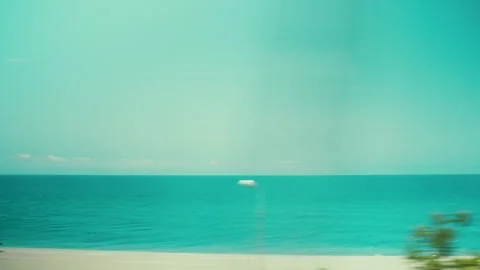 View of a sandy beach in Calabria from a train window Stockbeeldmateriaal 340272948