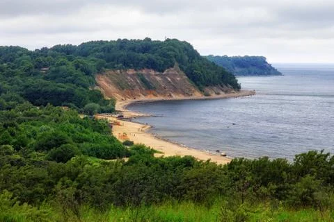 View of the sandy beach, cliffs and a beautiful cove on the Baltic Sea. Stock Photos