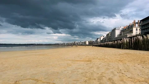 View of the sandy beach of Plage de l’Eventail, English Channel under a stormy. Stock Footage 311955643