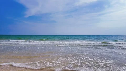 View of sandy beach, sea and sky in summer Stock Footage 274834053