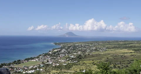 View of Sandy Point Town, St. Kitts with Sint Eustatius Island in the distance Stock Footage 233856131