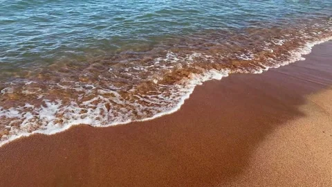 View of the sandy seashore with an incoming wave Video stock 232653171