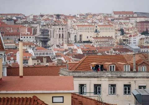 View of Santa Justa elevator and Carmo church ruins over Lisbon red tiled roo Stock Photos