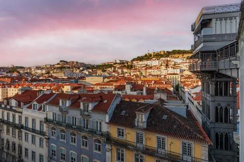 View of the Santa Justa elevator next to old buildings,with the castle of S.. Stock Photos