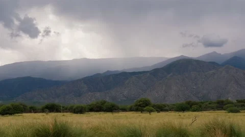 View Of Savannah And Mountain Landscape In Rainy Weather Stock Footage 168058172