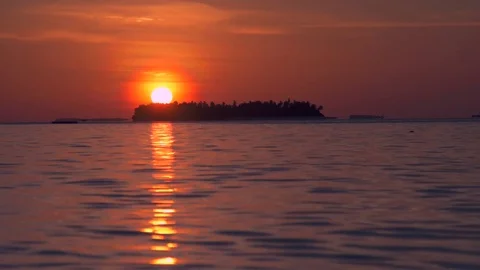 View of a scenic tropical island at sunset in the Maldives. Stock Footage
