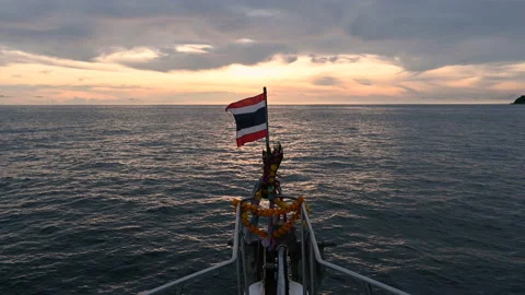 View from scuba diving prow boat with Thai flag on the bow and garland for worsh Stock Footage 163653929