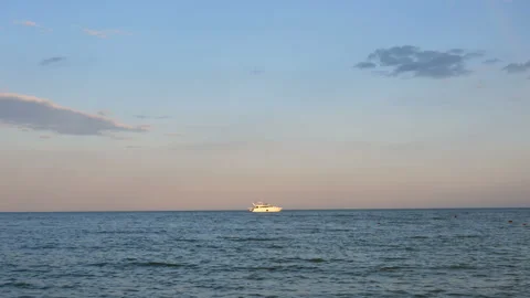 View to the sea and little ship on sunset. Stock Footage 112237585
