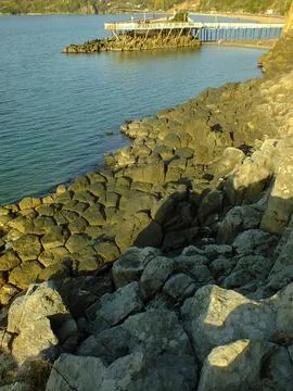The view of the sea and mountains with columnar basalts Stock Photos