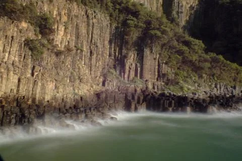 The view of the sea and mountains with columnar basalts Stock Photos