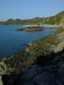 The view of the sea and mountains with columnar basalts Stock Photos