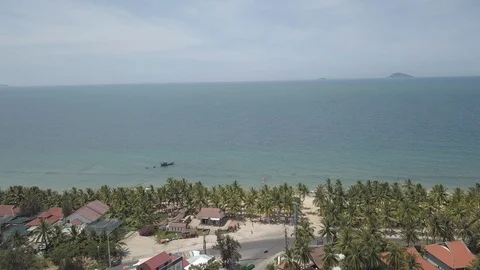 View of the sea and palm trees in a small Asian city Stock-Footage 112796981