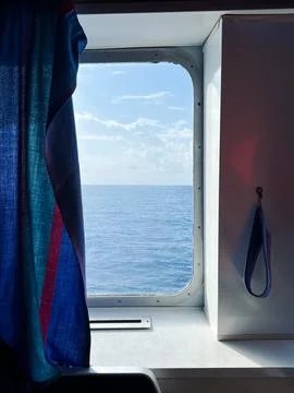 View of the sea and sky from the window of moving ferry Stock Photos