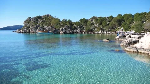 View Of The Sea Bay With Shallow Clear Water And Rocky Shore Stock Footage 195993317