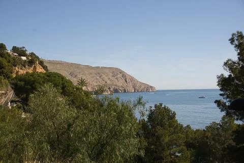 View of the sea between vegetation, located in Alicante, Spain Stock Photos