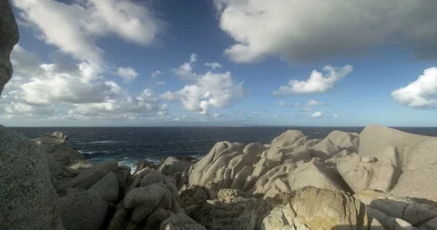 View of the sea from Capo Testa through the rocks, time lapse, 4K. Stock Footage 120411718