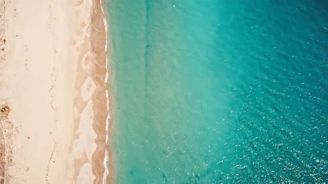 View of sea coast from the top. Small waves, transparent water Stock Footage 145168741