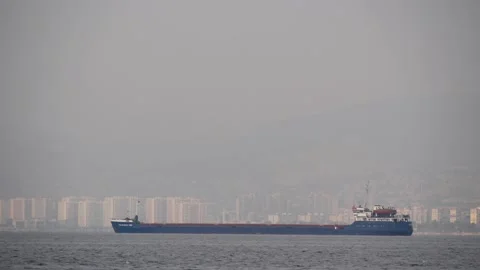 View From The Sea On A Large Tanker Ship Near The City On A Misty Mountain Shore Stock Footage 196092386
