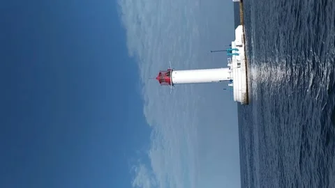View of the sea lighthouse from a moving ship Stock Footage 196987009