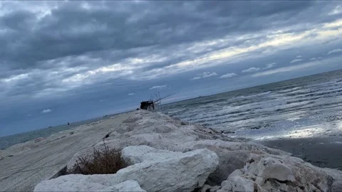 View of the sea at sunset from the dam Stock-Footage 224695586