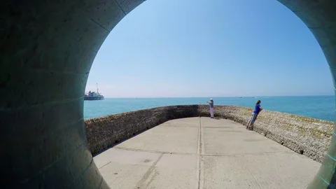 View of the sea through a huge pipe in Brighton, UK Stock Footage 79934631