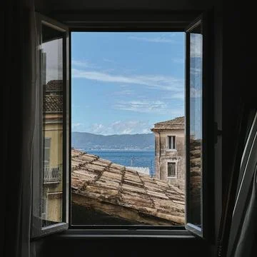 View of Sea Through Open Window Stock Photos