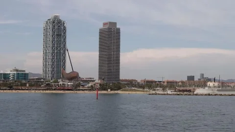 View from the sea with Torre Mapfre, Hotel Arts and the El Peix d'Or, barce.. Stock Footage 286050090